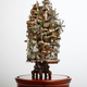 Illustration for article titled Artist transforms bonsai trees and empty cans into insane Lilliputian cities